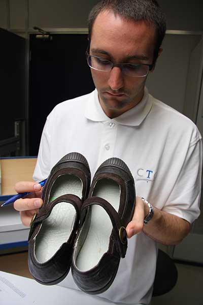Man doing a footwear quality control check