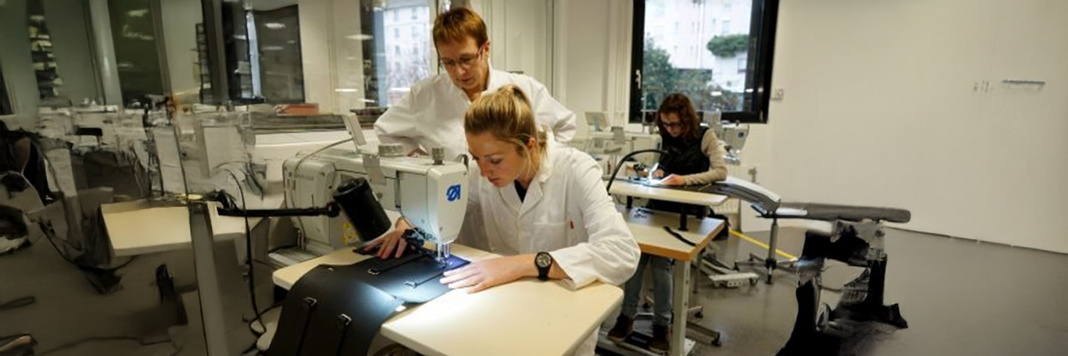 Trainee in leather goods training at the workstation